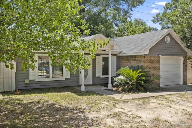 view of front of property with brick siding and an attached garage