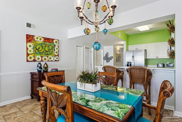 dining area with a chandelier