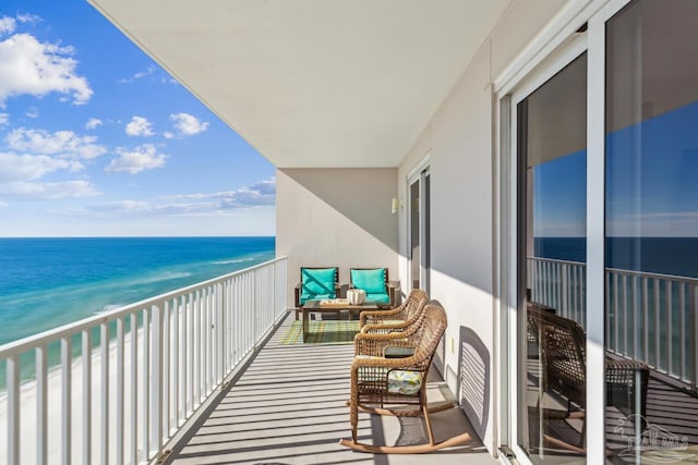 balcony with a view of the beach and a water view