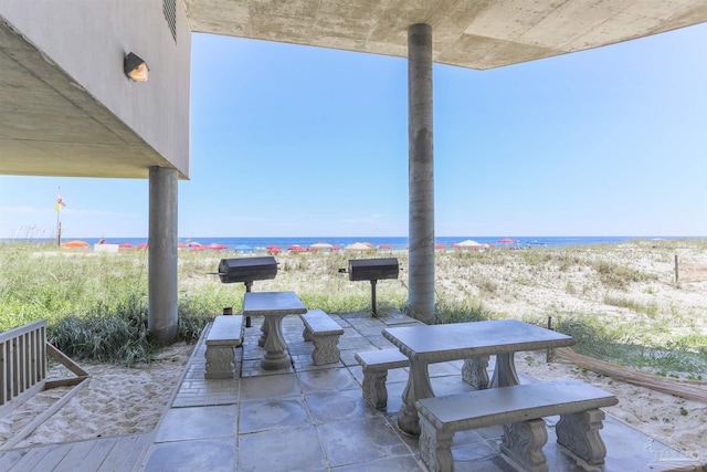 view of patio featuring a water view