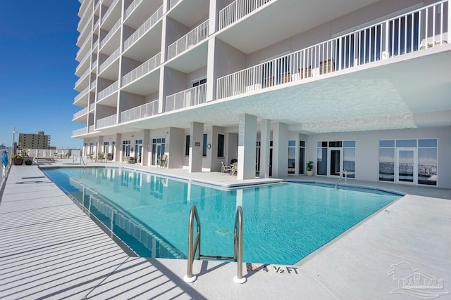 view of pool featuring a patio