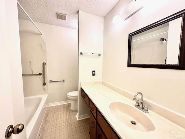 full bathroom featuring toilet, vanity, tub / shower combination, and a textured ceiling