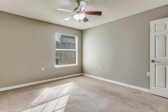 carpeted empty room featuring a textured ceiling and ceiling fan