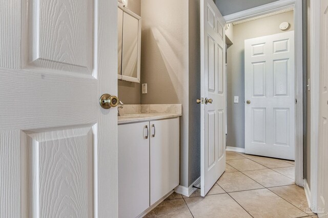 321 Loveland Cir, Pensacola, FL 32526 - bathroom with tile patterned floors, vanity, and baseboards