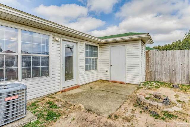 property entrance featuring central AC and a patio