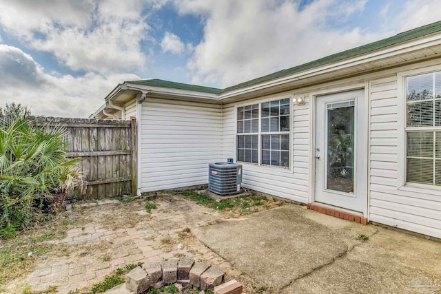 321 Loveland Cir, Pensacola, FL 32526 - view of home's exterior with cooling unit, a patio, and fence
