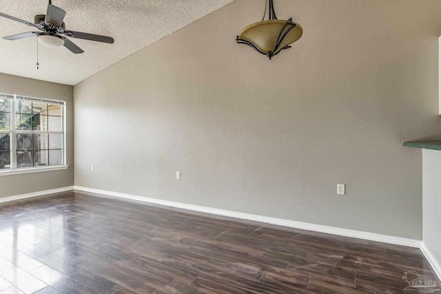 321 Loveland Cir, Pensacola, FL 32526 - spare room featuring dark wood-style flooring, a textured ceiling, lofted ceiling, baseboards, and a ceiling fan