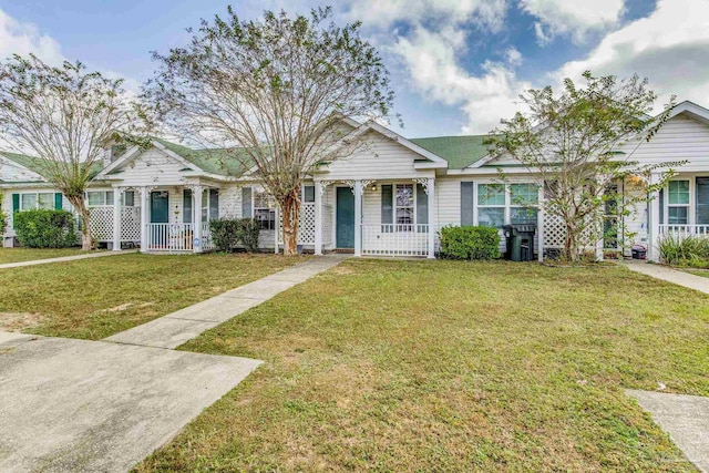 view of front of property with a porch and a front lawn