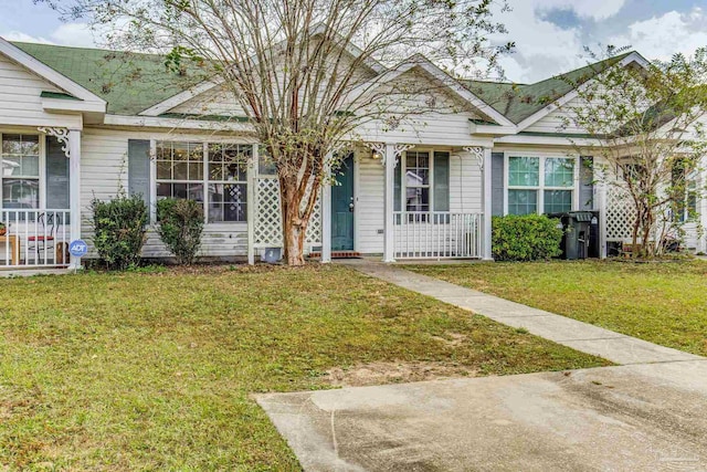 bungalow-style home featuring a front yard