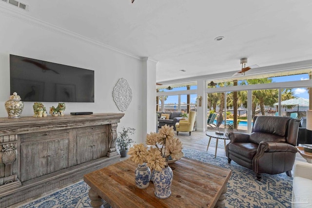 8209 Pompano St, Navarre, FL 32566 - living room featuring ornamental molding, ceiling fan, french doors, and wood finished floors
