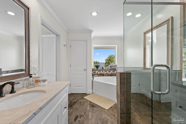 8209 Pompano St, Navarre, FL 32566 - full bathroom featuring ornamental molding, vanity, a garden tub, a closet, and recessed lighting