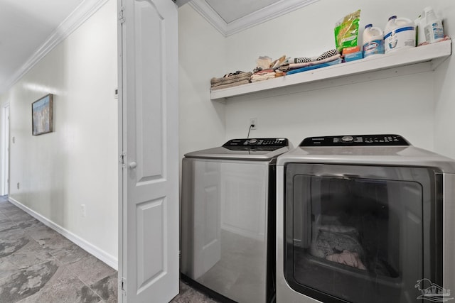 8209 Pompano St, Navarre, FL 32566 - laundry room featuring ornamental molding, washing machine and clothes dryer, and light stone finish flooring