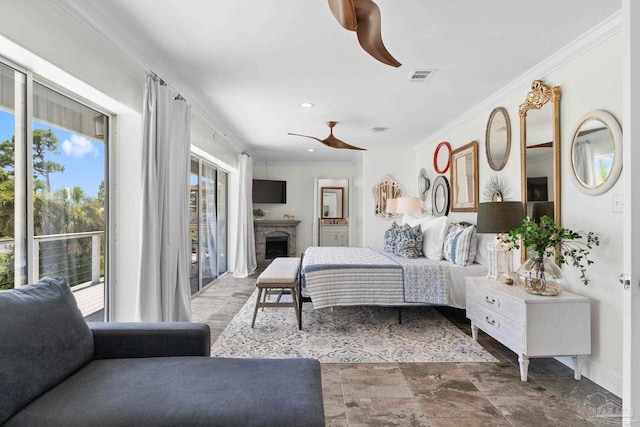 8209 Pompano St, Navarre, FL 32566 - bedroom featuring access to exterior, crown molding, a fireplace, stone finish floors, and a ceiling fan