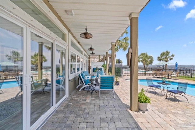 8209 Pompano St, Navarre, FL 32566 - view of patio featuring a community pool
