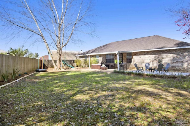 view of yard with a fenced backyard and a patio