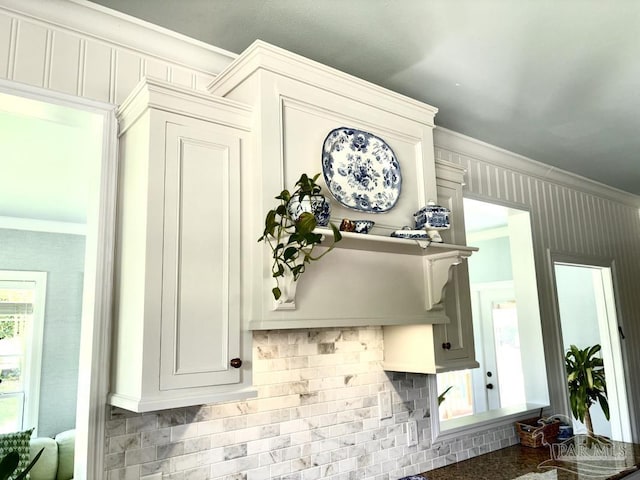 2367 Greenbrier Blvd, Pensacola, FL 32514 - kitchen view of ornamental molding, backsplash, and white cabinetry