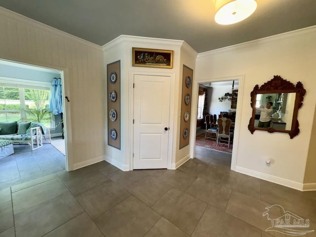 2367 Greenbrier Blvd, Pensacola, FL 32514 - entrance foyer with crown molding, baseboards, and dark tile patterned floors