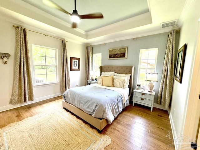 2367 Greenbrier Blvd, Pensacola, FL 32514 - bedroom with a raised ceiling, ornamental molding, wood-type flooring, baseboards, and a ceiling fan