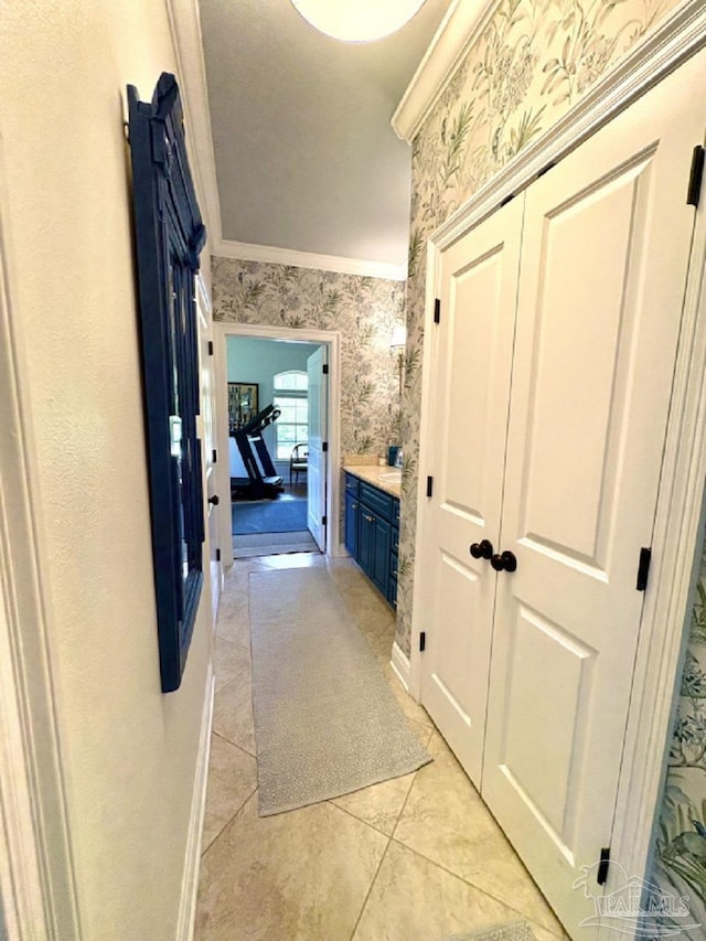 2367 Greenbrier Blvd, Pensacola, FL 32514 - hall with wallpapered walls, ornamental molding, and light tile patterned floors