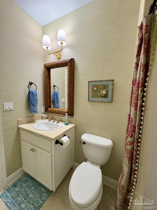 2367 Greenbrier Blvd, Pensacola, FL 32514 - bathroom featuring vanity, toilet, tile patterned flooring, and baseboards