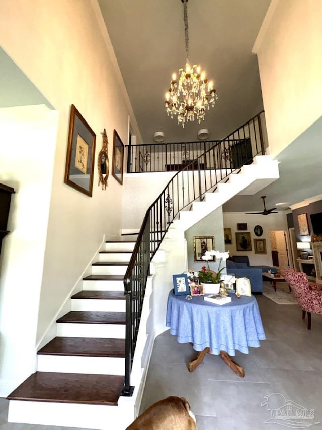 2367 Greenbrier Blvd, Pensacola, FL 32514 - stairs with a high ceiling and a chandelier
