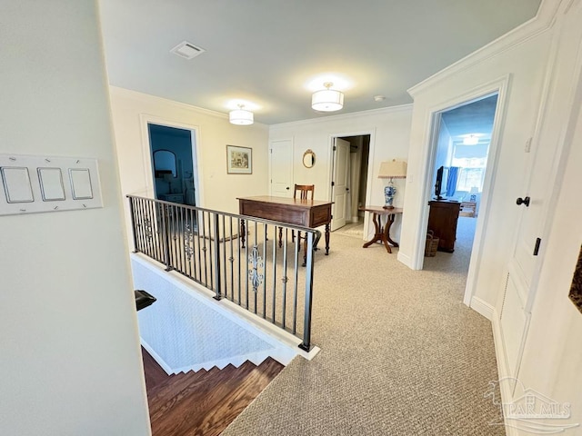 2367 Greenbrier Blvd, Pensacola, FL 32514 - hall with crown molding, an upstairs landing, baseboards, and light carpet