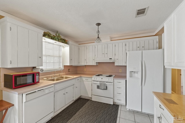 kitchen featuring sink, a textured ceiling, decorative light fixtures, white appliances, and white cabinets