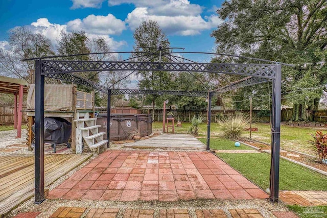 view of patio / terrace featuring a jacuzzi and a deck