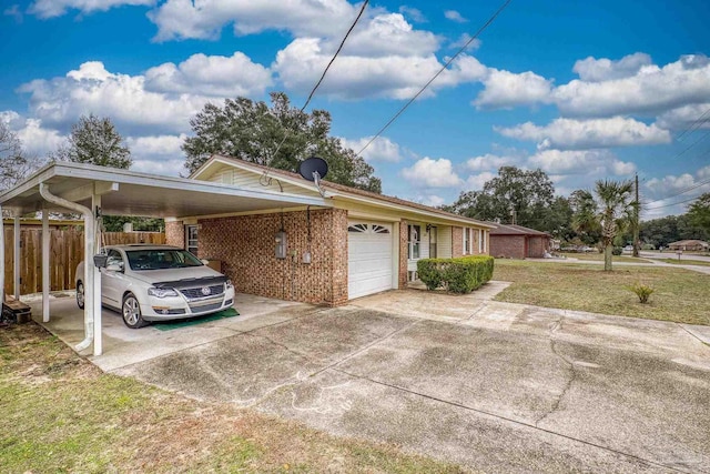 view of front of home featuring a front lawn, a garage, and a carport