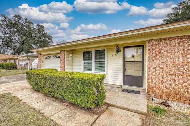 doorway to property featuring a garage