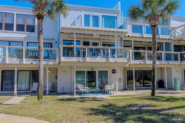 exterior space with a lawn and a patio