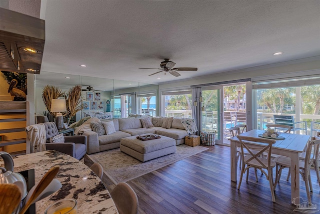 living room featuring a textured ceiling, wood finished floors, a ceiling fan, and recessed lighting