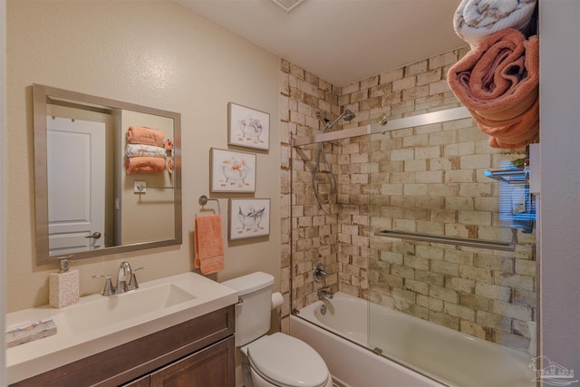 bathroom featuring shower / bathtub combination, vanity, and toilet