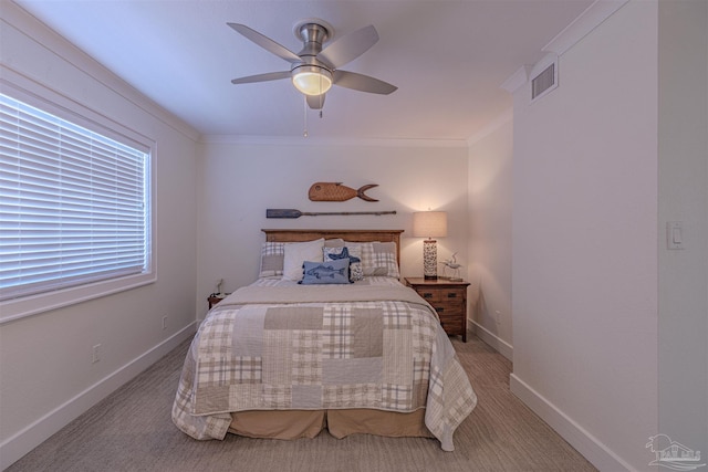 bedroom with light colored carpet, visible vents, ornamental molding, a ceiling fan, and baseboards