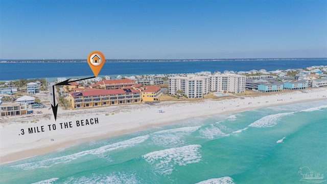 aerial view featuring a water view and a view of the beach