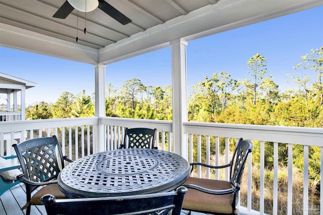 6548 Carlinga Dr, Pensacola, FL 32507 - wooden terrace with outdoor dining area and a ceiling fan