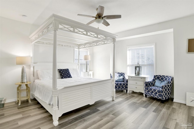 6548 Carlinga Dr, Pensacola, FL 32507 - bedroom featuring multiple windows, wood finished floors, and a ceiling fan