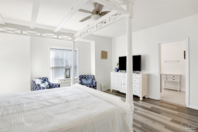 6548 Carlinga Dr, Pensacola, FL 32507 - bedroom with baseboards, a ceiling fan, beam ceiling, light wood finished floors, and ensuite bath
