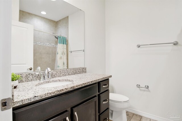 6548 Carlinga Dr, Pensacola, FL 32507 - full bathroom featuring vanity, recessed lighting, toilet, a shower with shower curtain, and baseboards