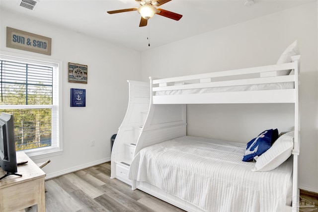 6548 Carlinga Dr, Pensacola, FL 32507 - bedroom featuring visible vents, baseboards, a ceiling fan, and wood finished floors
