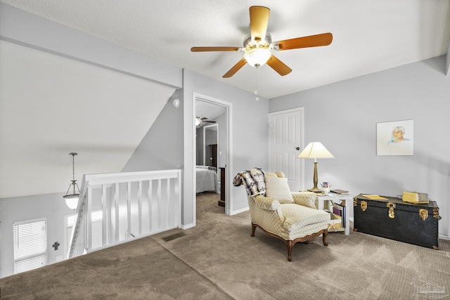 living area with carpet floors and vaulted ceiling