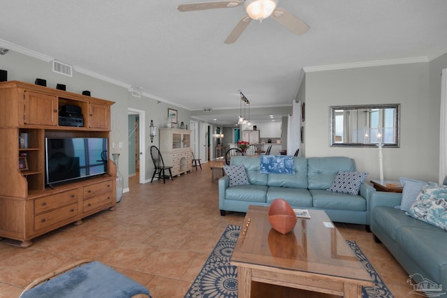 living room with ceiling fan, light tile patterned flooring, and crown molding