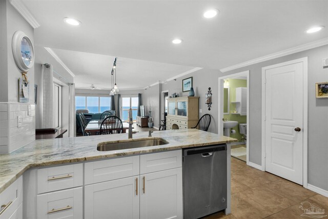 bedroom featuring a closet, light tile patterned flooring, ensuite bath, crown molding, and ceiling fan