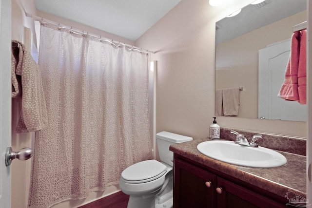 full bathroom featuring hardwood / wood-style flooring, shower / tub combo with curtain, vanity, and toilet