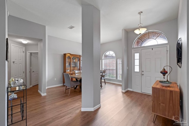 entryway with hardwood / wood-style floors