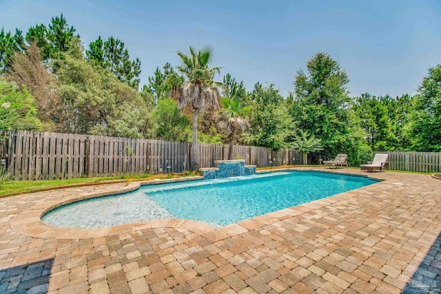 view of swimming pool featuring a patio and pool water feature