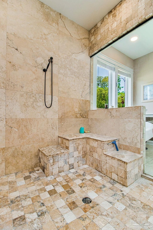 bathroom with a tile shower