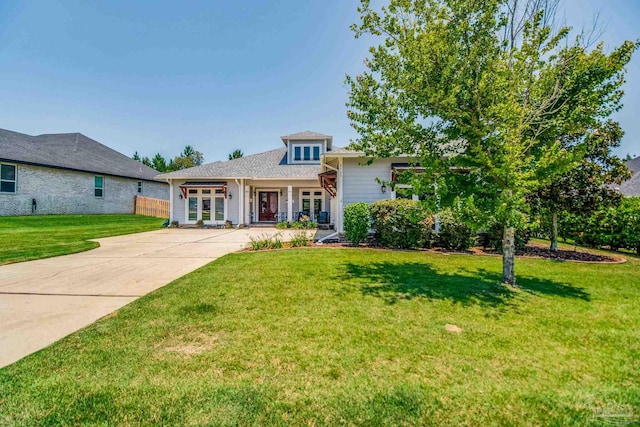 view of front facade featuring a front yard and french doors