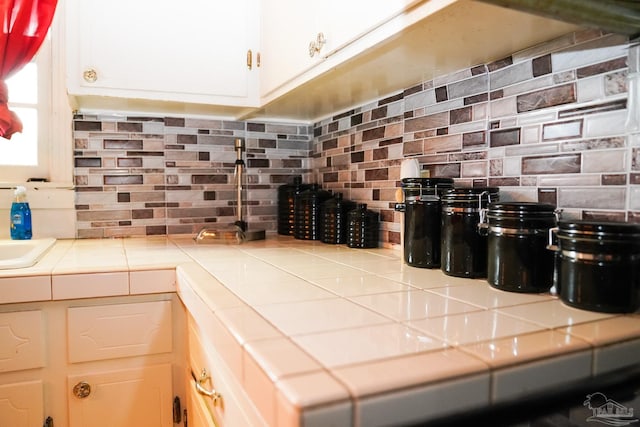 kitchen with tile countertops and decorative backsplash