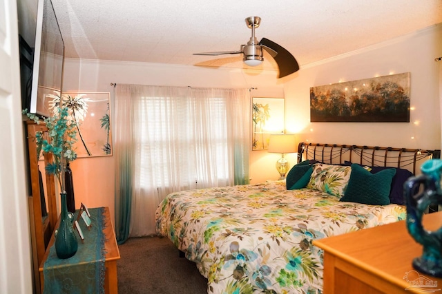 bedroom with ceiling fan, carpet flooring, a textured ceiling, and ornamental molding